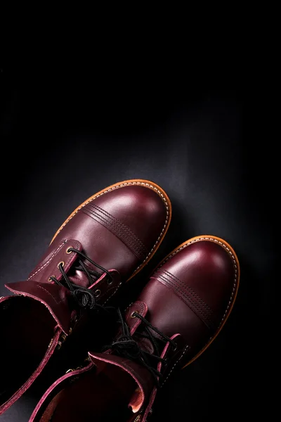 Fashionable mens leather brown shoes on black background. . Men's high boots. Top view. Copy space. — Φωτογραφία Αρχείου