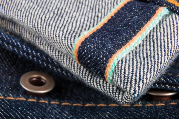 Close up of jeans fragment with button. Denim texture. Selvage. — Stock Photo, Image