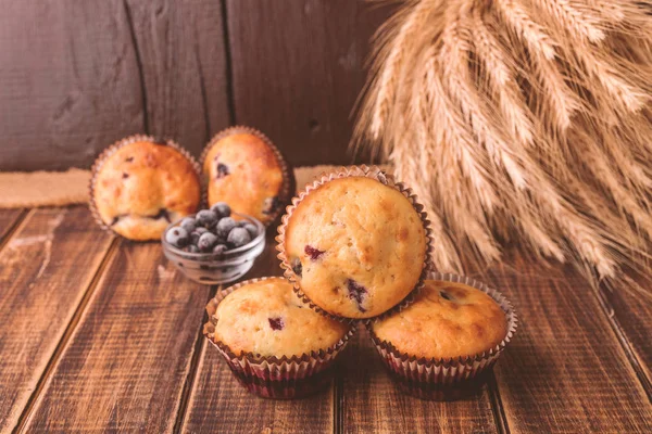 Muffins on wooden background. Cupcake — Stock Photo, Image