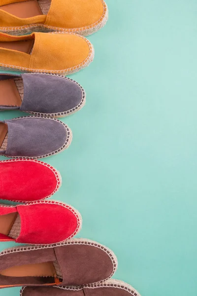 Four pair of espadrilles on mint color background. Top view. Copy space. — Stock Photo, Image