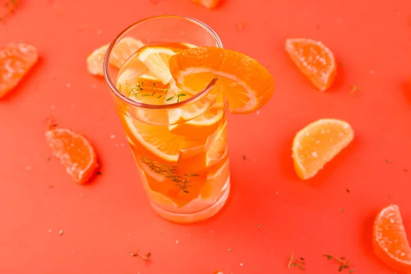 Orange fruit cocktail, detox water on orange background — Stock Photo, Image