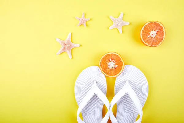 Summer Concept White Flip Flops Orange Fruit Starfish Yellow Paper — Stock Photo, Image