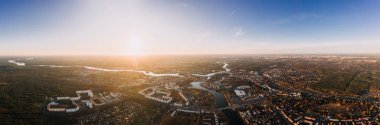 panorama drone photo of the old city Treptow-Kopenick Berlin at sunrise clipart