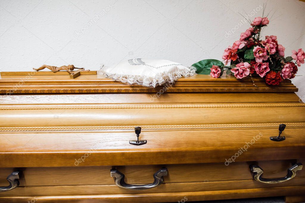 photo of a wooden casket in a funeral