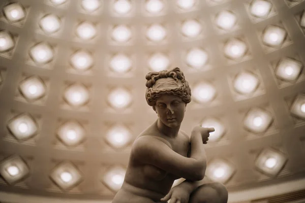 photo of a Greek sculpture in a cultural hall