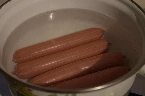 Sausages cooked in the pot of water — Stock Photo, Image