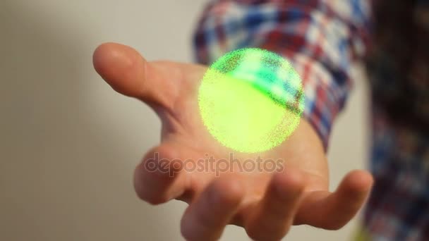 Przemieszczania się wiele pięknych cząstek na dłoni człowieka — Wideo stockowe