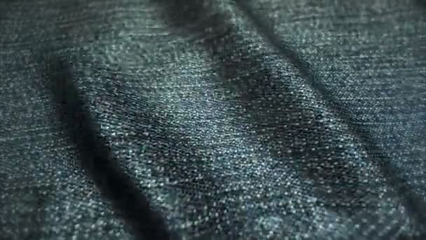 Jeans realistici che ondeggiano nel vento. Sfondo astratto Risoluzione Ultra-HD. Struttura del tessuto close-up. loop senza soluzione di continuità — Video Stock