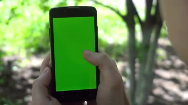 Close-up of male hands touching of smartphone. Green screen Chroma Key. Close up. Tracking motion — Stock Video