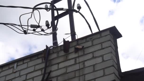 Silhouette of an electrician climbing a newly installed utility pole — Stock Video