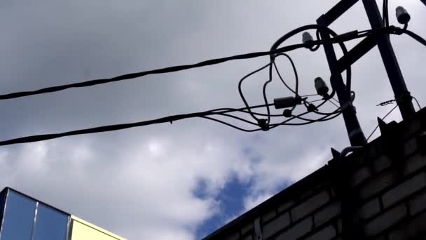 Silhouette of an electrician climbing a newly installed utility pole — Stock Video