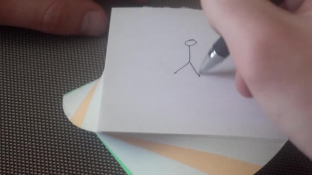 mec dessine une image, puis traverse et froisse le papier, jette 