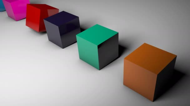 La rotation des cubes de différentes couleurs sur le sol 