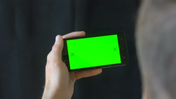 Close-up of male hands touching of smartphone. Green screen Chroma Key. Close up. Tracking motion. Vertical. pants. - Swipe left right animation black 6 — Stock Video