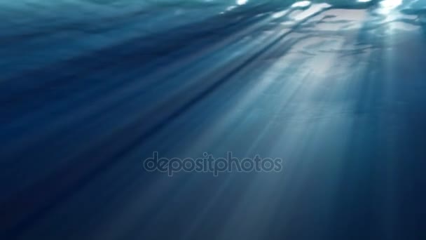 High quality Looping animation of ocean waves from realistic underwater. Light rays shining through — Stock Video