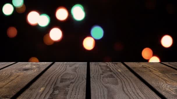 Legno prospettico e bokeh sfondo della notte e il bagliore scintillante delle luci. visualizza elemento modello — Video Stock