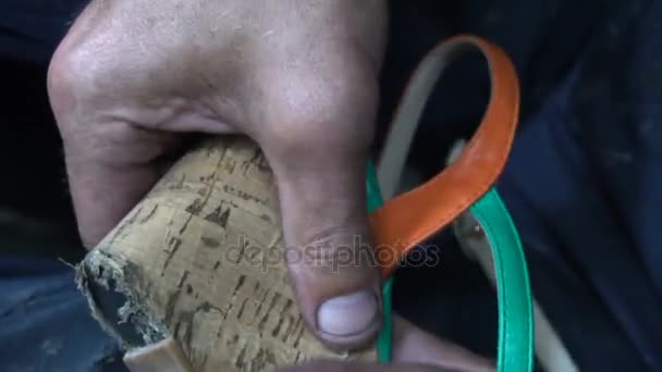 The shoemaker at work.The process of repairing shoes in workshop — Stock Video