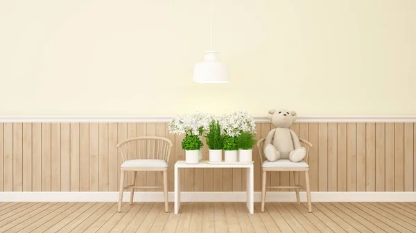 Teddy bear and flower in yellow room