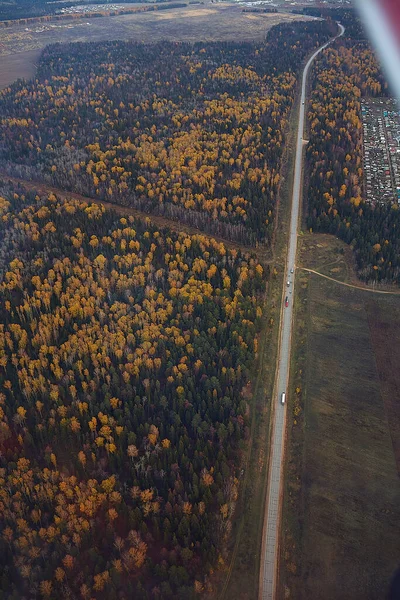 aerial view, suburb, autumn forest, cars on the road