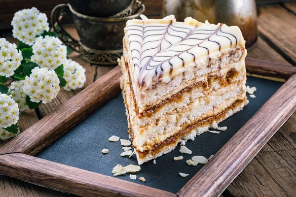 esterhazy, nut cake, a piece of cake close-up, cake with nuts, cake on a wooden table