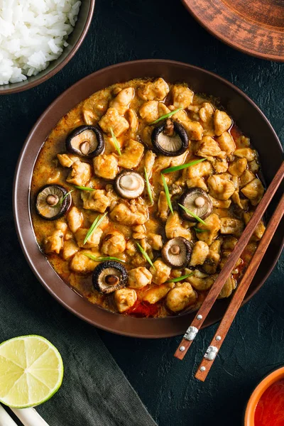 stock image Panang Gai, Delicious spicy Thai food of chicken with shiitaki mushrooms on a black background