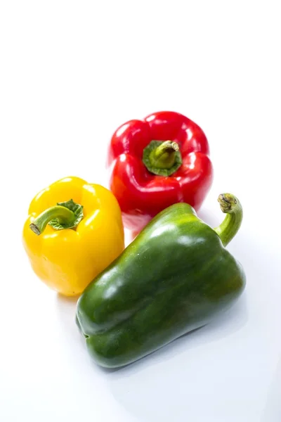 Three bell peppers isolated on white background — Stock Photo, Image