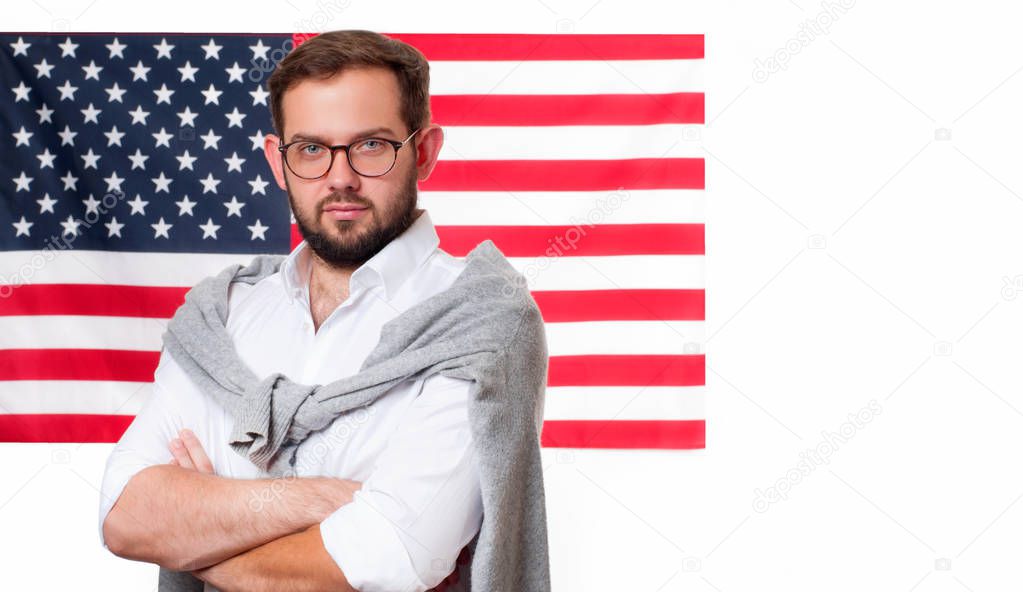 Smiling young man on United States flag background. 