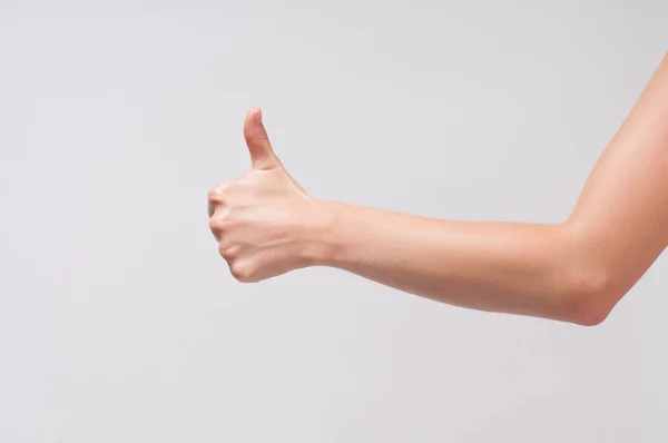 Nő kéz hüvelykujj fel fehér háttér — Stock Fotó