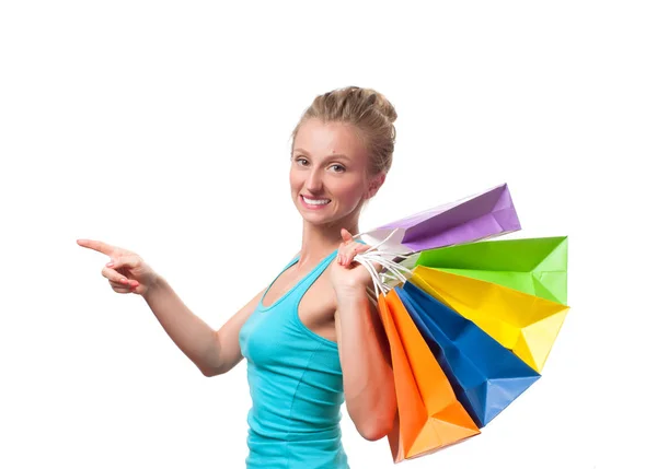 Chica feliz shopaholic con bolsas de compras de colores, sobre fondo blanco — Foto de Stock