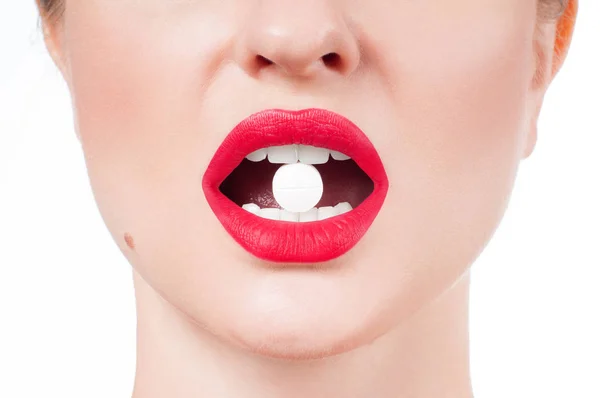 Female mouth with red lips and medicine pill — Stock Photo, Image