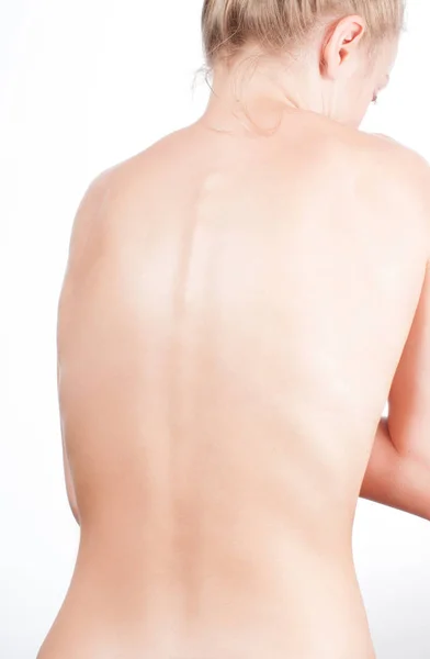 Жінка ззаду, голе тіло, концепція болю — стокове фото