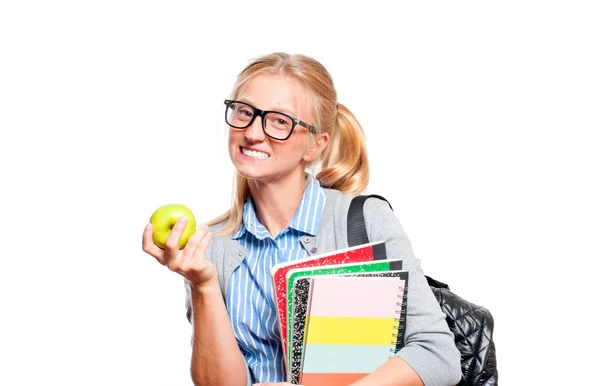 Feliz joven estudiante sosteniendo libros. Regreso a la escuela — Foto de Stock