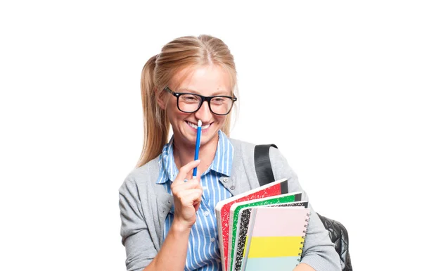 Feliz joven estudiante sosteniendo libros. Regreso a la escuela —  Fotos de Stock