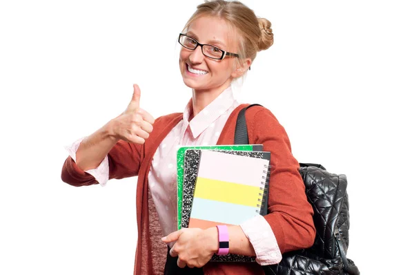 Feliz joven estudiante sosteniendo libros. Regreso a la escuela — Foto de Stock