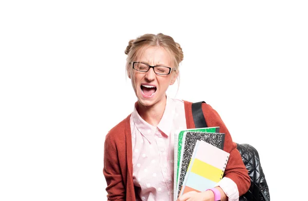 Joven estudiante molesta sosteniendo libros. Regreso a la escuela — Foto de Stock