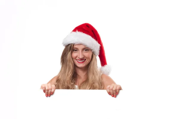 Χριστούγεννα. Όμορφη γυναίκα να φοράτε καπέλο Σάντα — Φωτογραφία Αρχείου