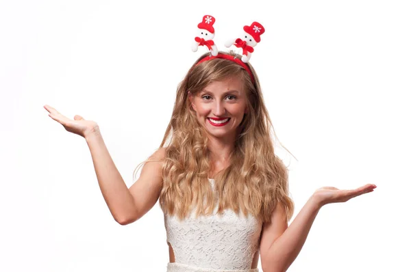 Christmas. Happy beautiful woman showing open palms — Stock Photo, Image