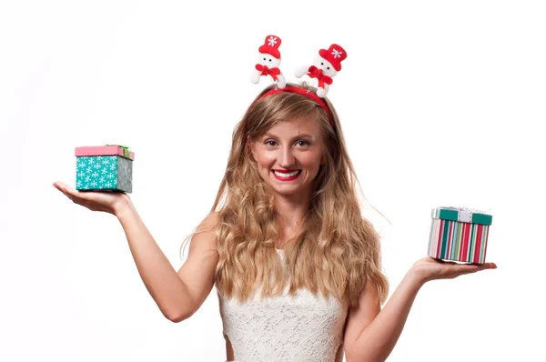 Christmas. Beautiful girls holding christmas gifts — Stock Photo, Image