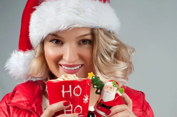 Christmas and New Year.  Woman holding a cup of coffee. — Stock Photo, Image