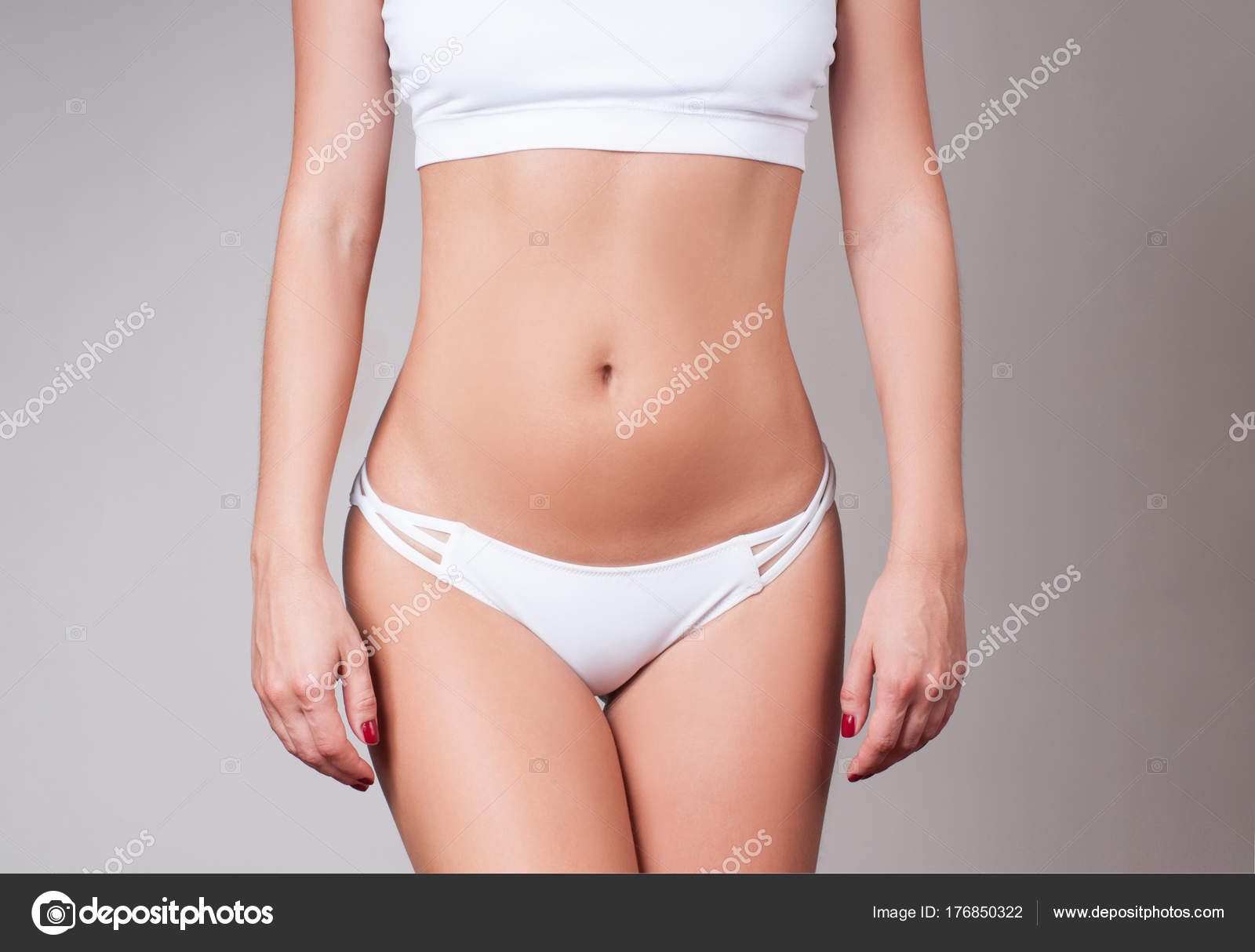 Woman waist. Girl with perfect body shape, flat belly in underwear