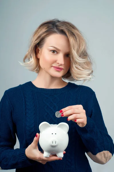 Savings concept. Woman holding piggy bank — Stock Photo, Image