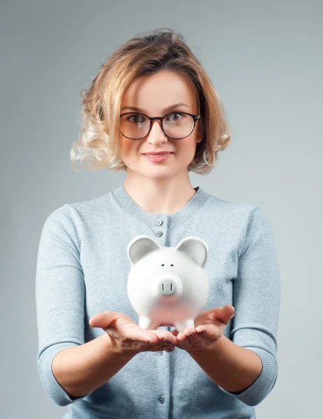 Savings concept. Woman holding piggy bank — Stock Photo, Image