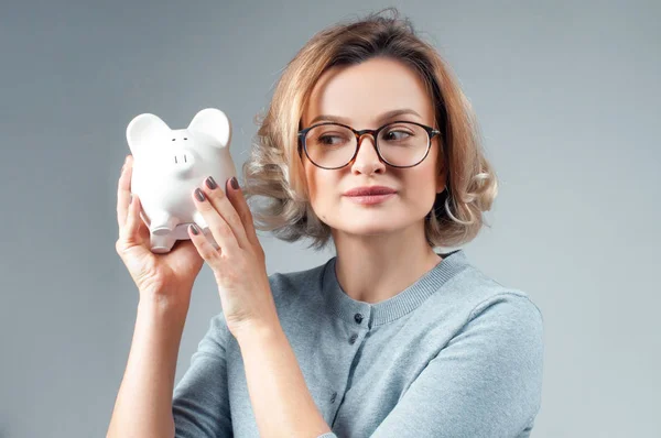Savings concept. Woman holding piggy bank — Stock Photo, Image