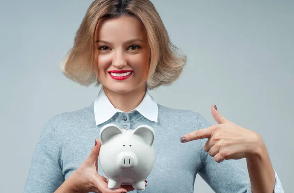 Savings concept. Woman holding piggy bank — Stock Photo, Image