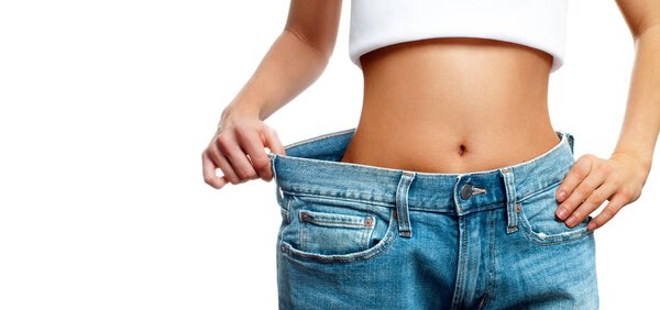 Woman is measuring waist after weight loss,. Diet concept