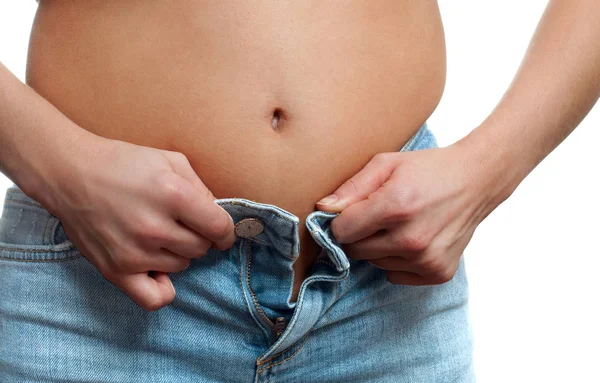 Overweight woman in jeans. Female body fat belly. — Stock Photo, Image