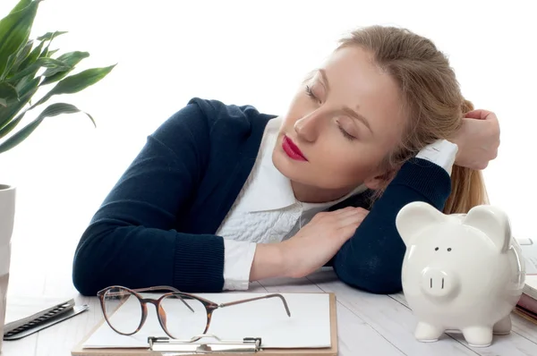 Overworked and tired young woman sleeping on desk at office — Stock Photo, Image