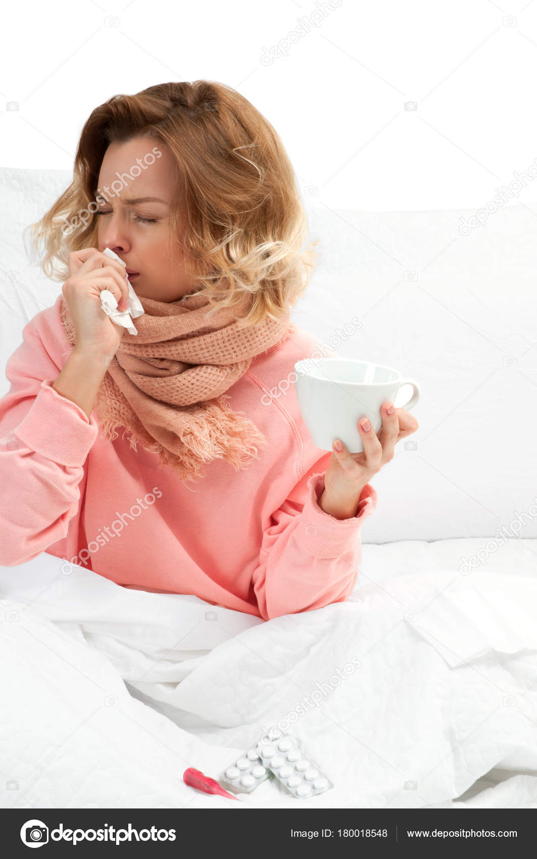 Woman having a cold, flu. Sore throat and coughing Stock Photo by