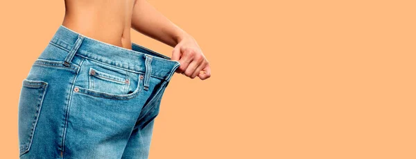 Woman wearing of jeans pants from back. Stock Photo by ©flisakd 321717330