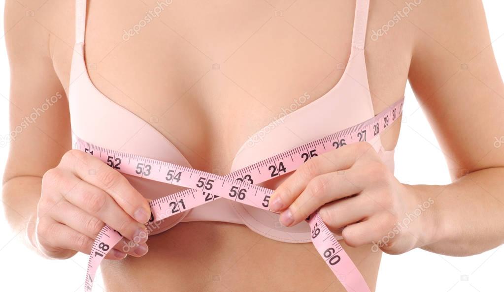 Perfect chest in pink bra. Woman measures her breast